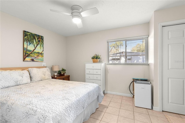 tiled bedroom with ceiling fan