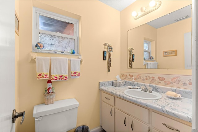 bathroom with vanity and toilet