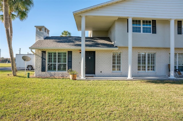 view of front of home with a front lawn