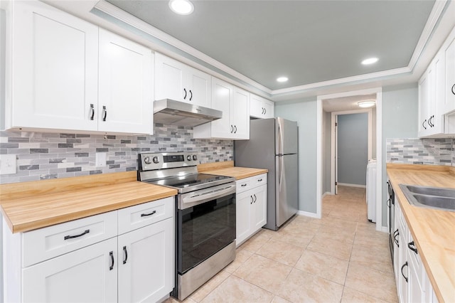 kitchen featuring tasteful backsplash, white cabinetry, wooden counters, and appliances with stainless steel finishes