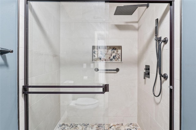 bathroom featuring an enclosed shower