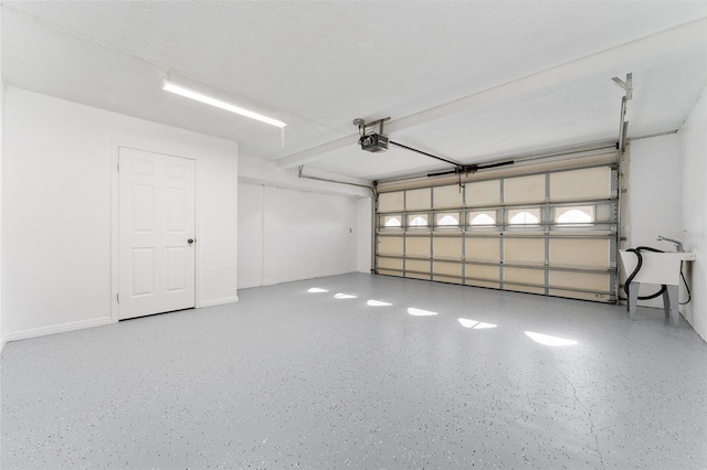 garage with sink and a garage door opener