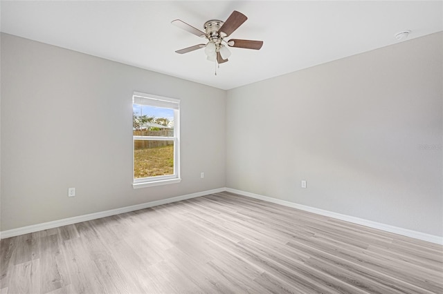 empty room with light hardwood / wood-style floors and ceiling fan