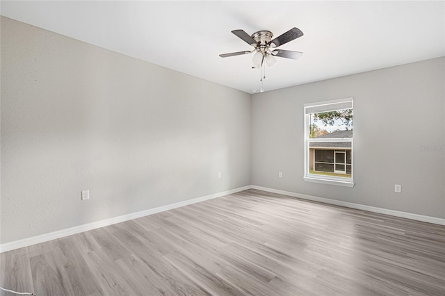 empty room featuring ceiling fan and light wood-type flooring