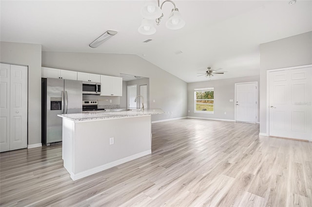 kitchen with appliances with stainless steel finishes, ceiling fan with notable chandelier, light hardwood / wood-style flooring, and white cabinetry