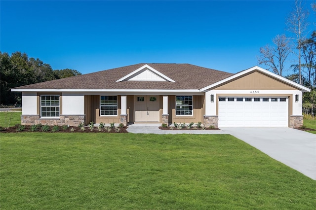 view of front facade with a front yard and a garage