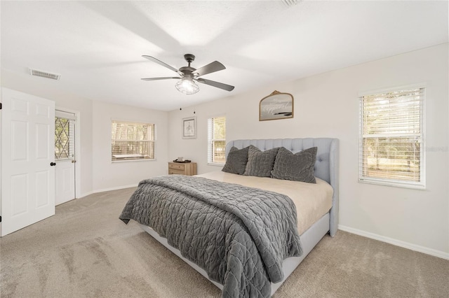 bedroom with ceiling fan and carpet