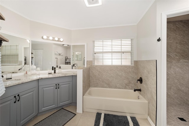 bathroom featuring vanity, tile patterned flooring, ornamental molding, and separate shower and tub