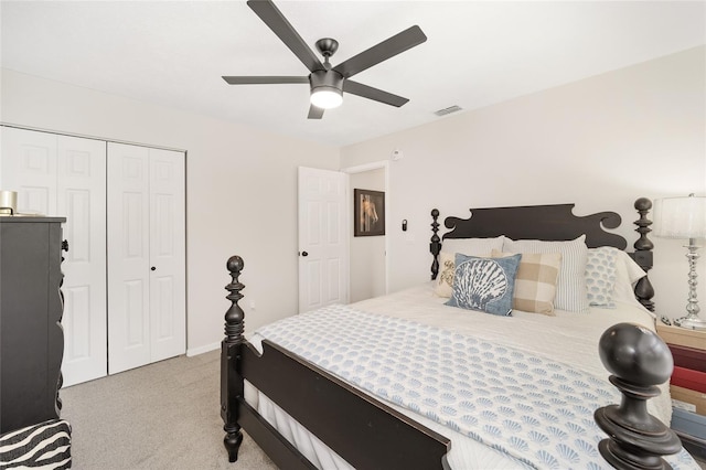 bedroom featuring ceiling fan, a closet, and light carpet