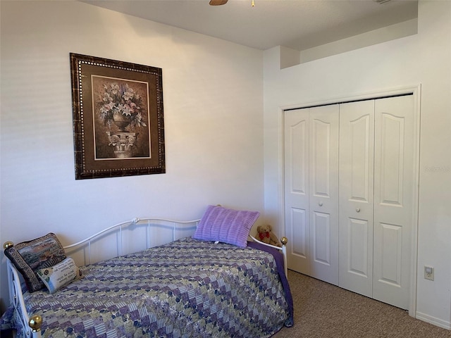 bedroom featuring carpet flooring, a closet, and ceiling fan