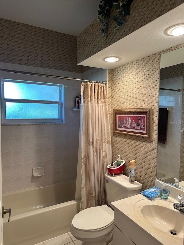 full bathroom with tile patterned flooring, shower / tub combo, vanity, and toilet