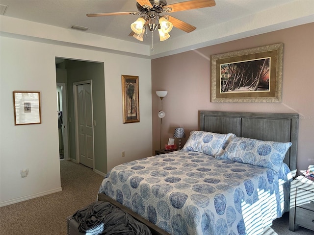 carpeted bedroom with ceiling fan