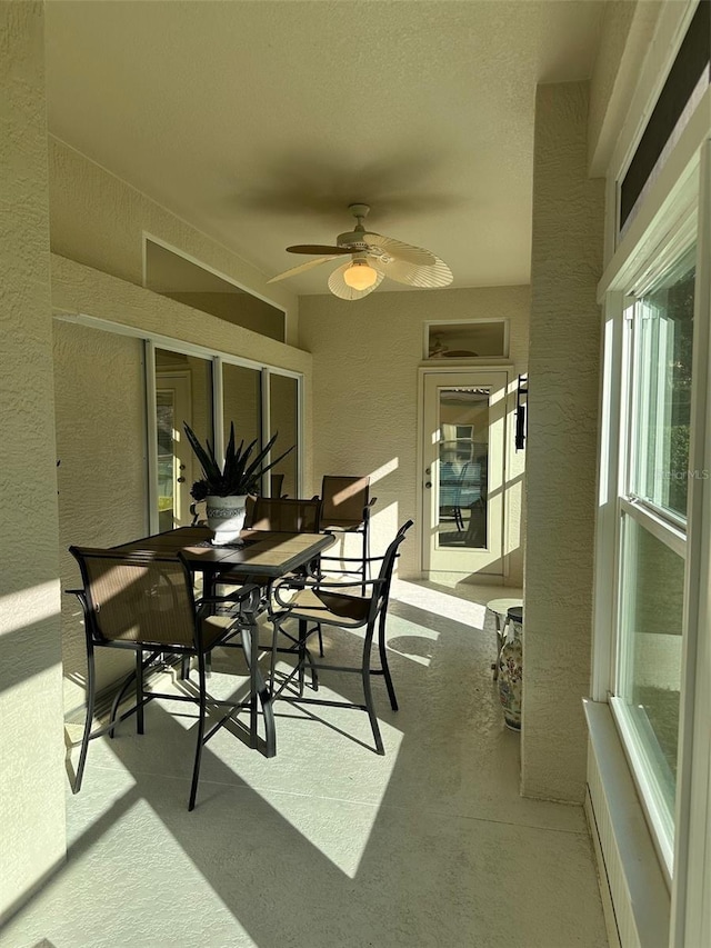 sunroom / solarium with ceiling fan