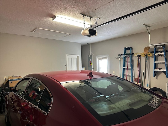 garage featuring a garage door opener and water heater