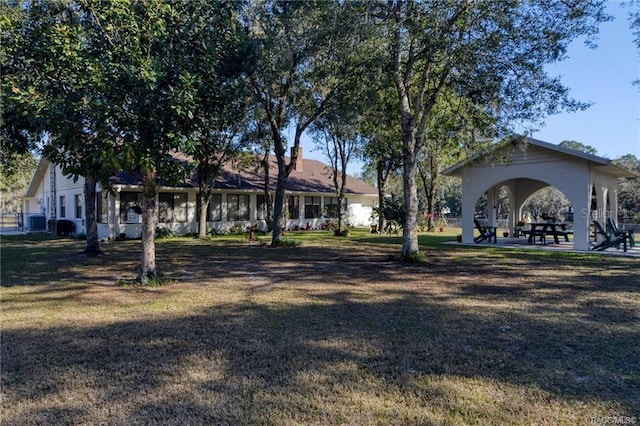 view of yard with a gazebo and central AC unit