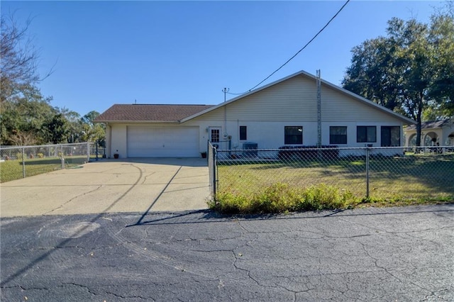 view of front of home with a garage and a front lawn