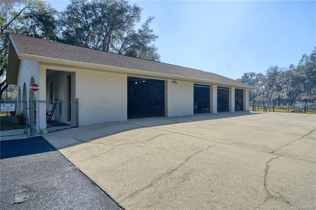 7424 N Nature Trl, Hernando, FL 34442 - garage featuring concrete driveway and a gate