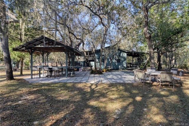 view of property's community with a patio area