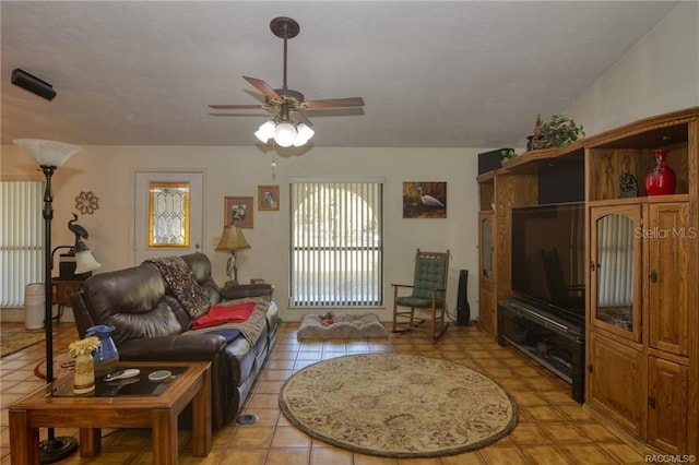 living room with ceiling fan and light tile patterned floors