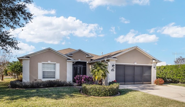 ranch-style home featuring a front yard and a garage