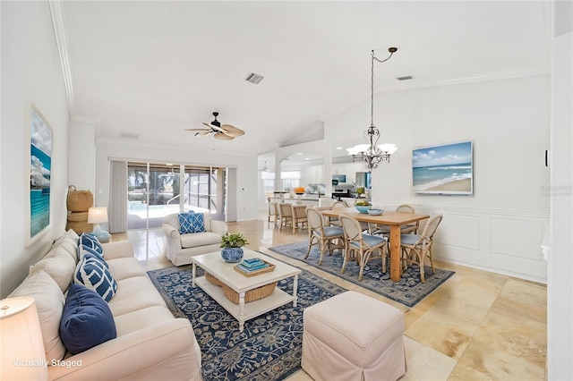 living room featuring vaulted ceiling, ornamental molding, and ceiling fan with notable chandelier