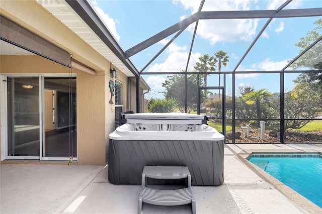 exterior space with a lanai and a swimming pool with hot tub