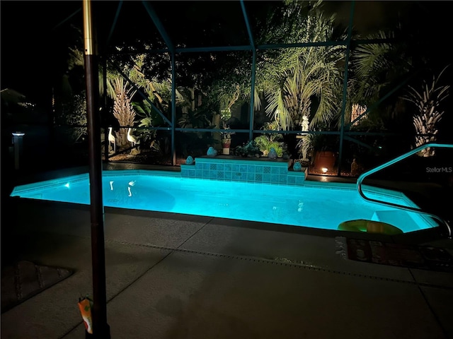 view of pool featuring a lanai