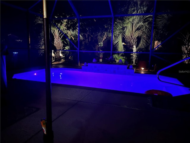 view of pool at night