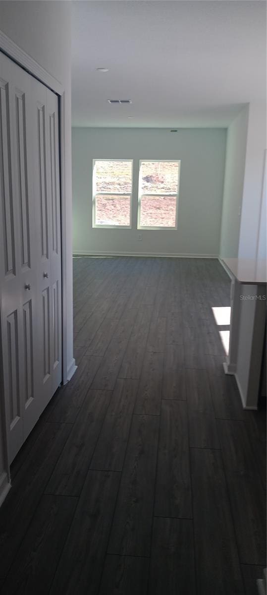 hall featuring dark wood-type flooring