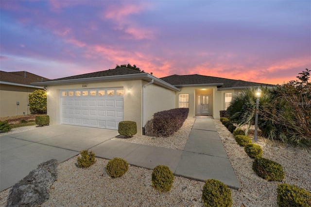 view of front of property with a garage