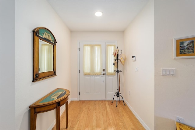 doorway to outside featuring light wood-type flooring