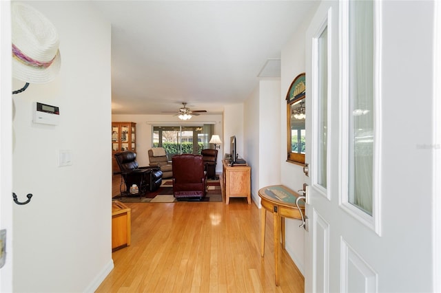 hall with light hardwood / wood-style flooring