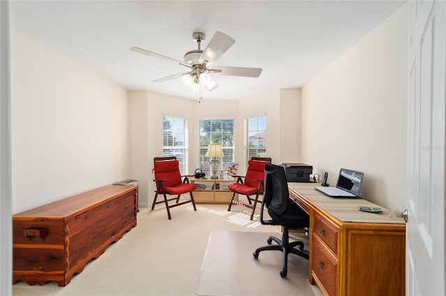 office space featuring ceiling fan and light colored carpet