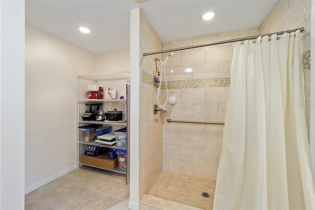 bathroom with tile patterned flooring and walk in shower