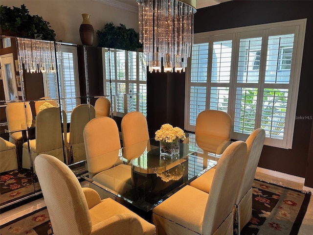 dining space featuring ornamental molding and a healthy amount of sunlight