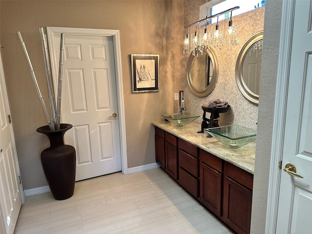 bathroom with vanity and decorative backsplash