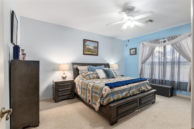 bedroom featuring ceiling fan and light colored carpet