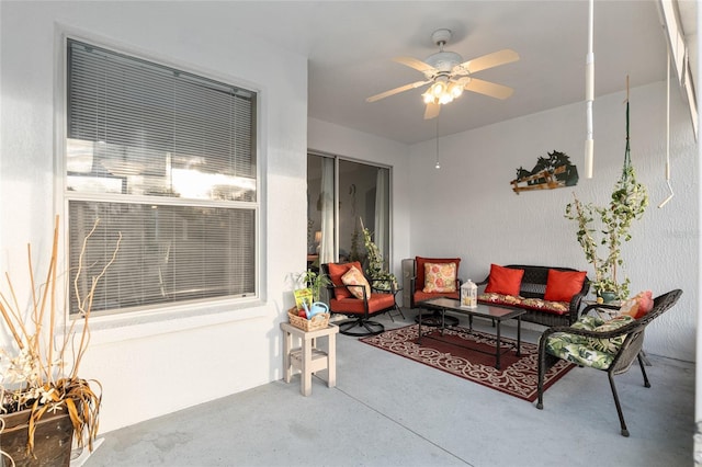 view of patio with ceiling fan and an outdoor hangout area