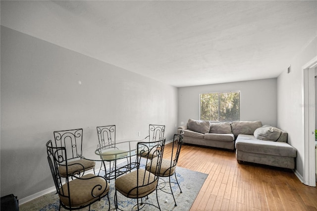 dining area featuring wood-type flooring