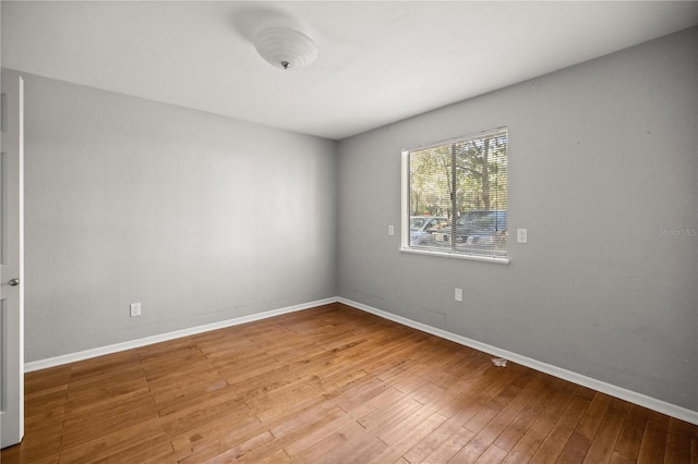 unfurnished room featuring hardwood / wood-style floors