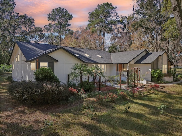 view of front of property with a lawn