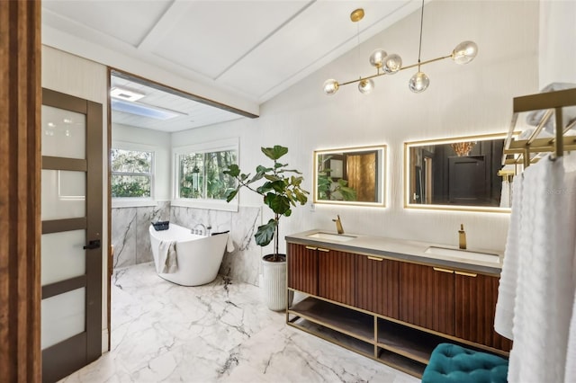 bathroom with vanity, lofted ceiling, a tub, and tile walls