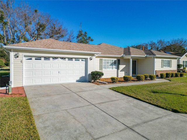 ranch-style house with a garage and a front lawn