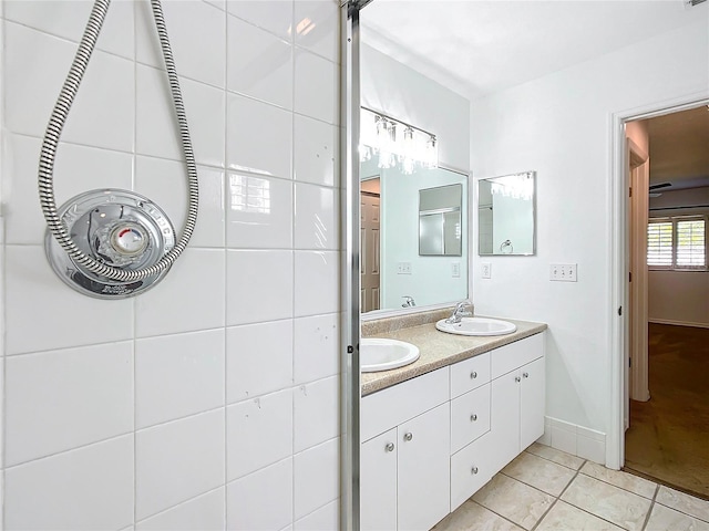 bathroom featuring tile patterned flooring and vanity