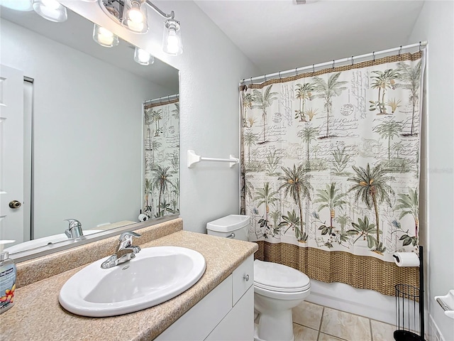 full bathroom featuring tile patterned floors, shower / bath combo, toilet, and vanity