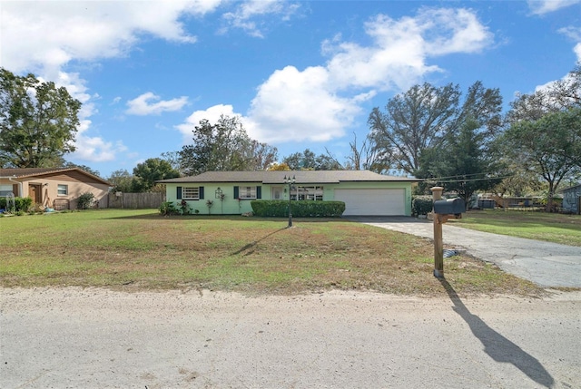 view of front of home with a garage and a front yard