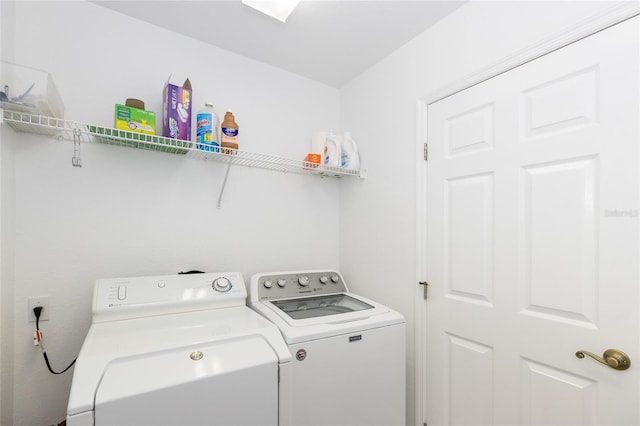 washroom with independent washer and dryer