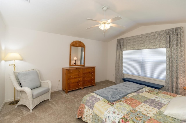 bedroom featuring ceiling fan, light carpet, and vaulted ceiling