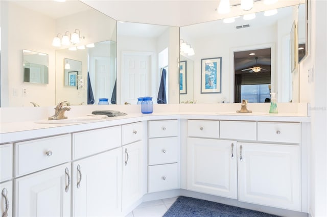 bathroom featuring tile patterned floors, ceiling fan, and vanity