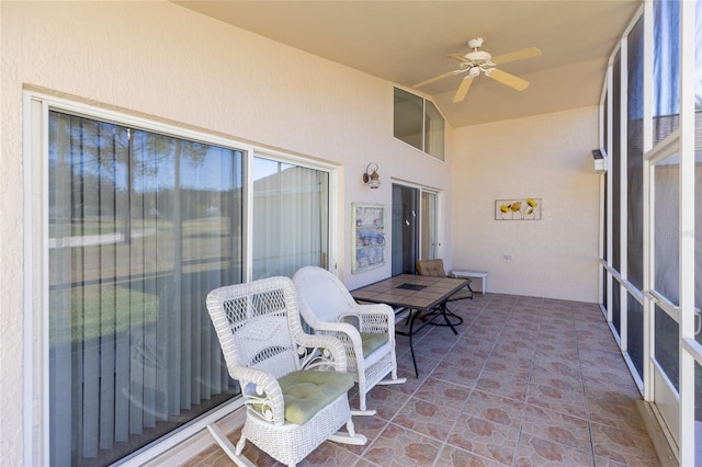 exterior space featuring ceiling fan